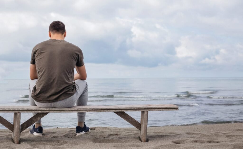 guy sitting lonely