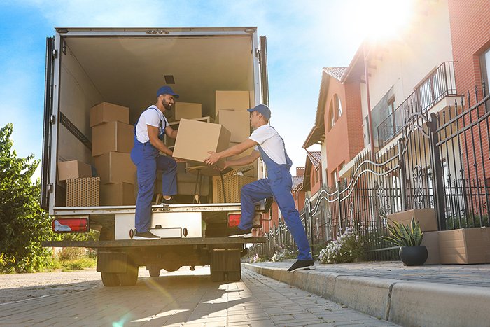 men unloading boxes